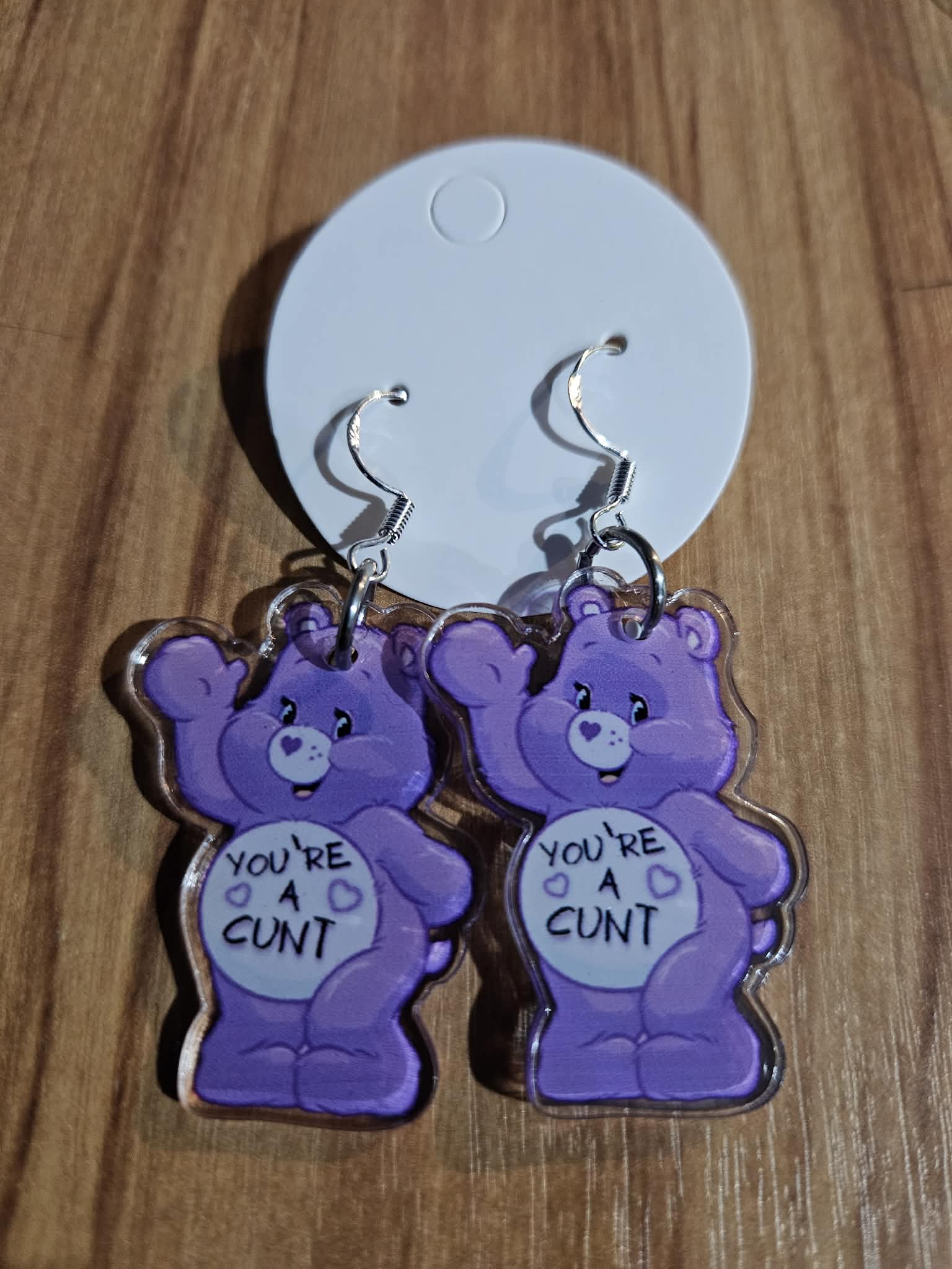 carebear earrings- you're a c*nt